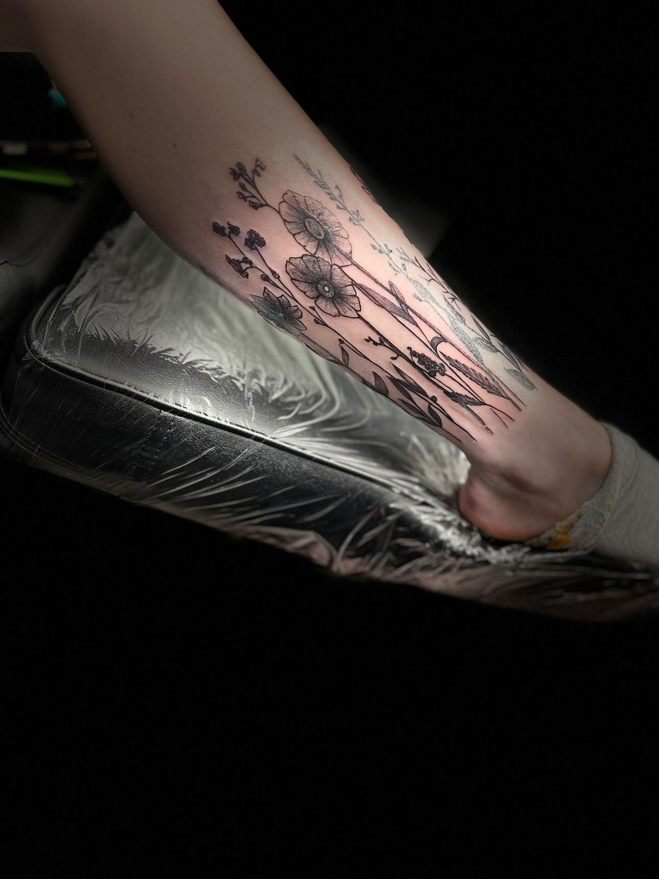 Botanical wildflower forearm tattoo